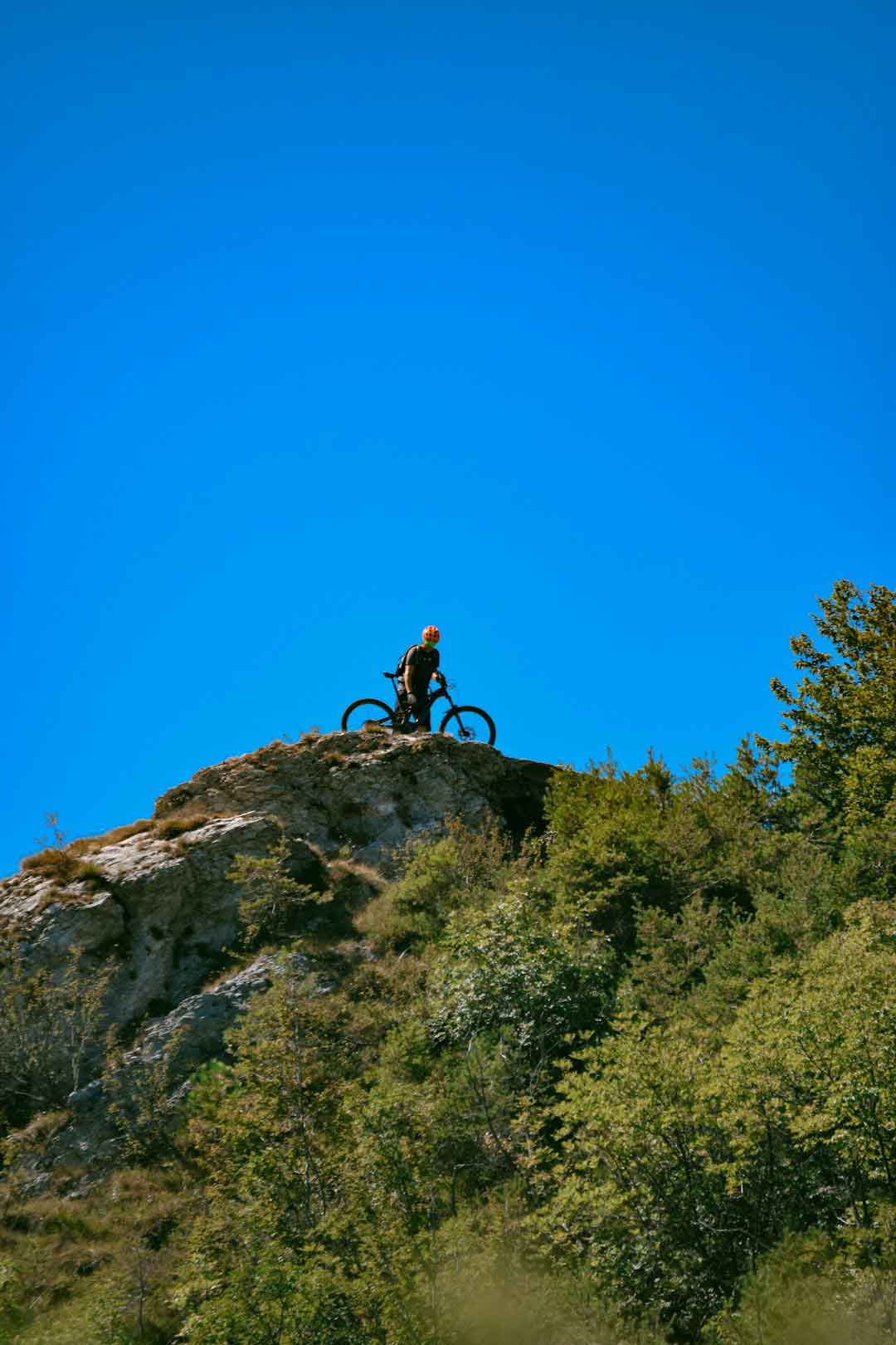 Cyclist enjoying a scenic ride on a BMC mountain bike