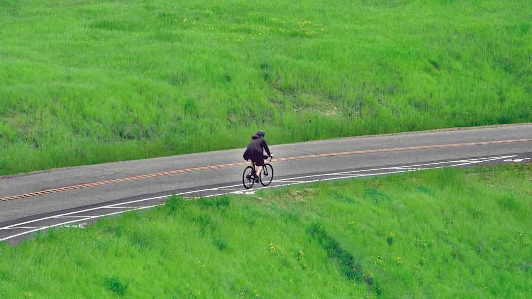Cyclist riding a BMC gravel bike on a trail
