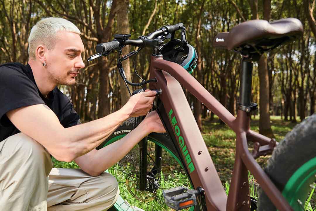 Person examining a mountain bike