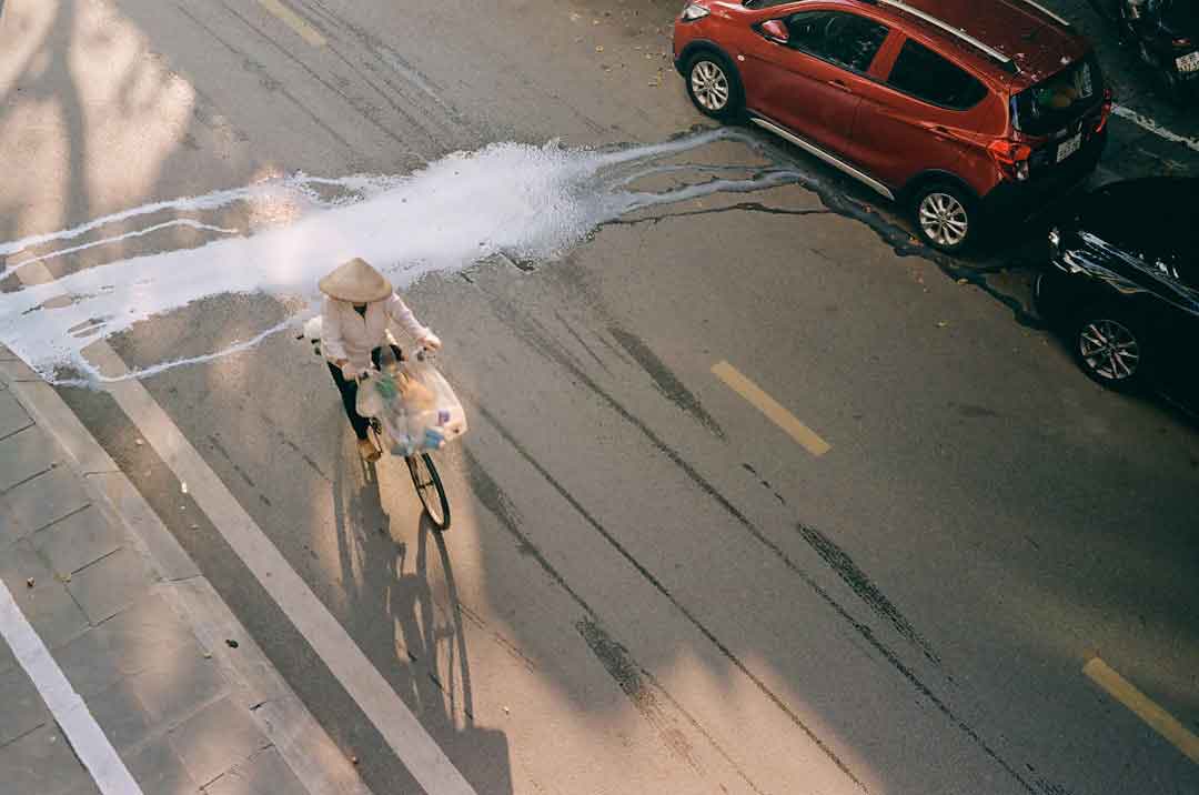 Cyclist performing maintenance on an endurance road bike